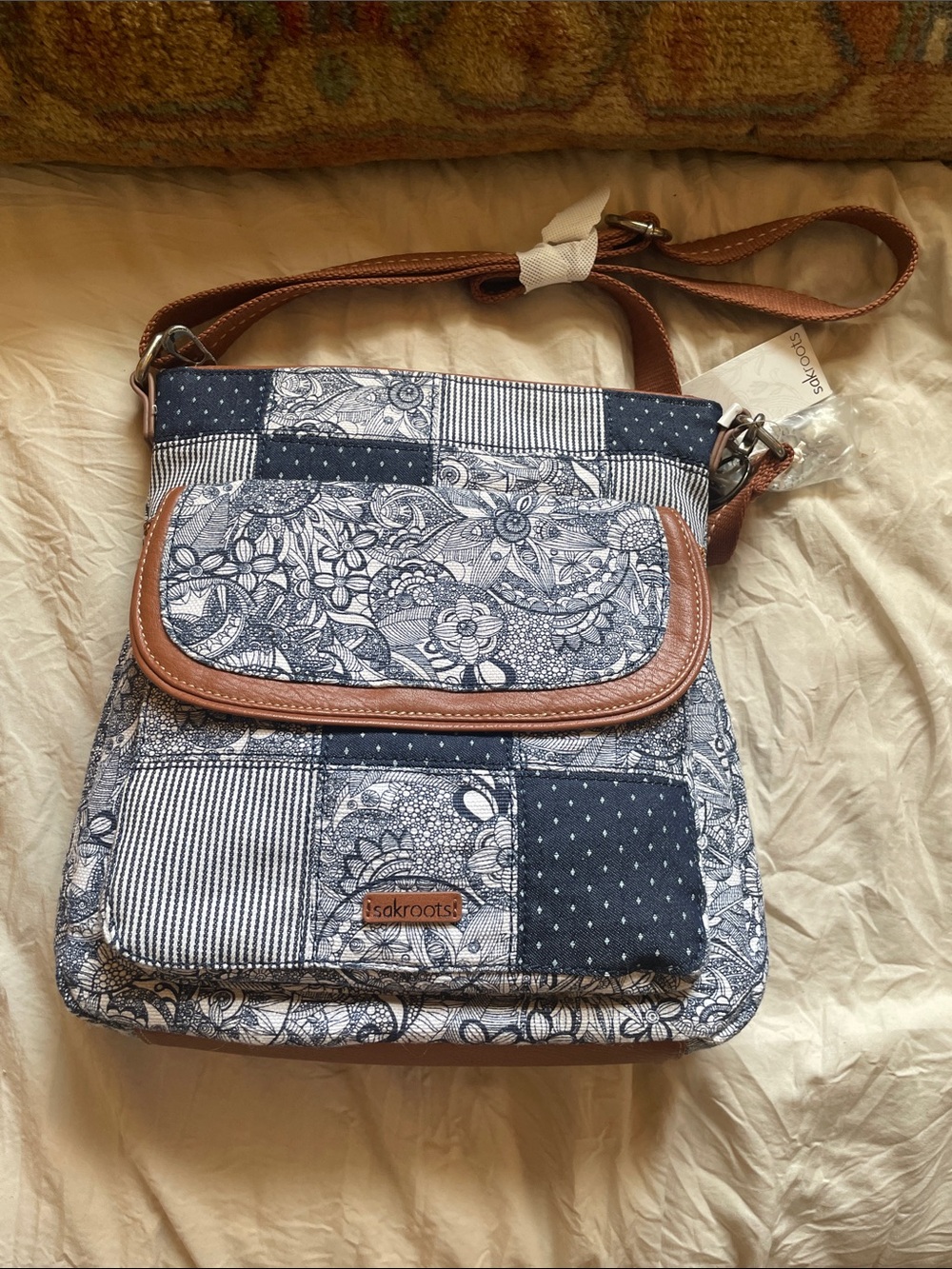 NWT Sakroots Navy and Brown Patchwork Floral Crossbody Bag
